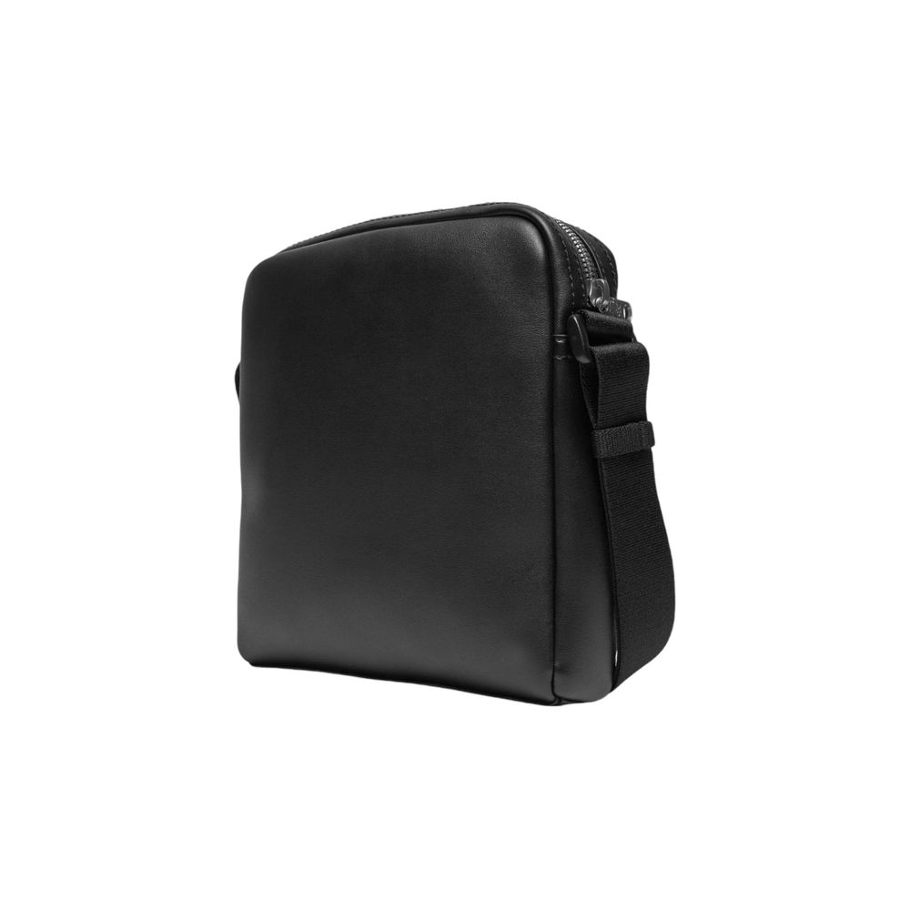 This Crossbody Messenger Bag by Calvin Klein Jeans for men in polyethylene & polyurethane black & signature presents a versatile silhouette from the Polyethylene & Polyurethane Crossbody Messenger Bag collection, featuring a secure , ample , and versatile crossbody-strap, shoulder-strap & adjustable-strap.