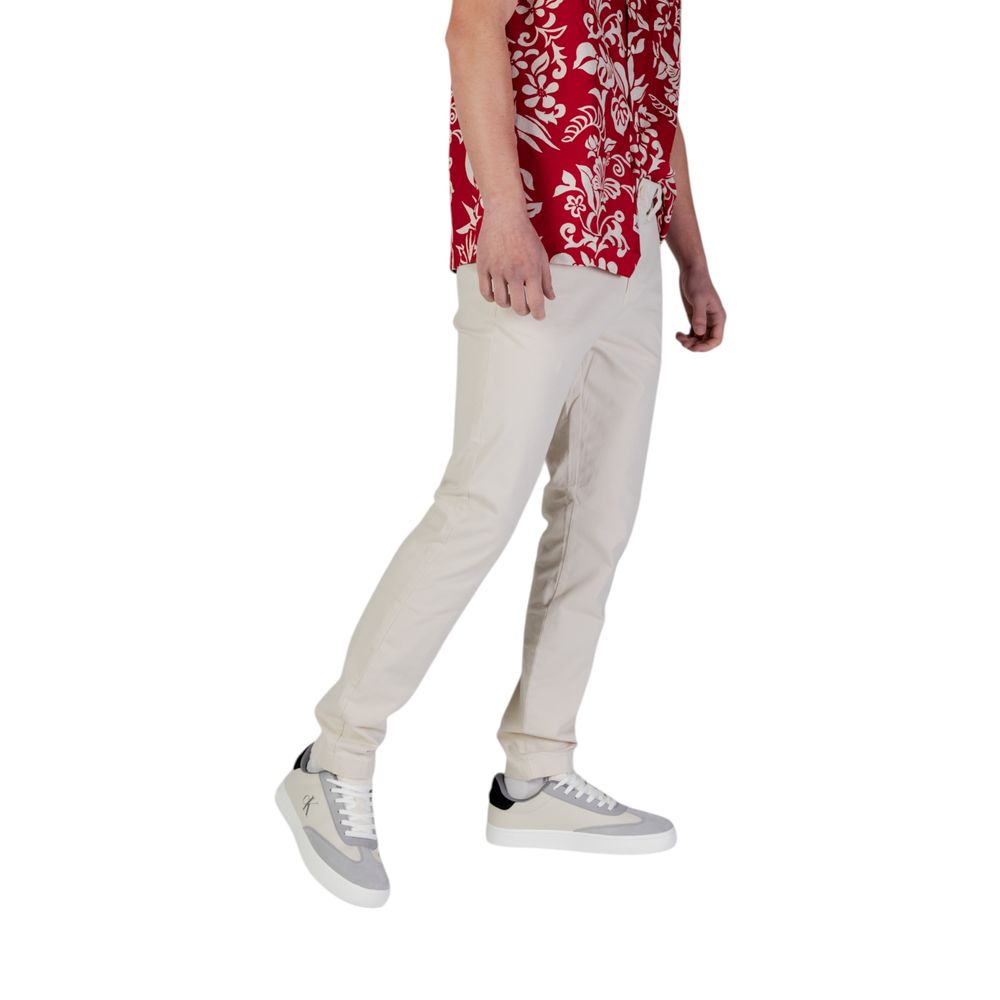 Trousers by Tommy Hilfiger Jeans for men in stretch cotton beige features an sartorial silhouette, showcasing a precise skinny & slim and long with a sartorial for a refined look.