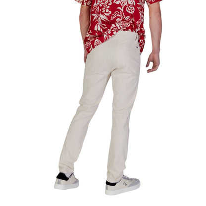 Trousers by Tommy Hilfiger Jeans for men in stretch cotton beige presents a smart silhouette, meticulously detailed with a smart skinny & slim, a smart long, and a smart .