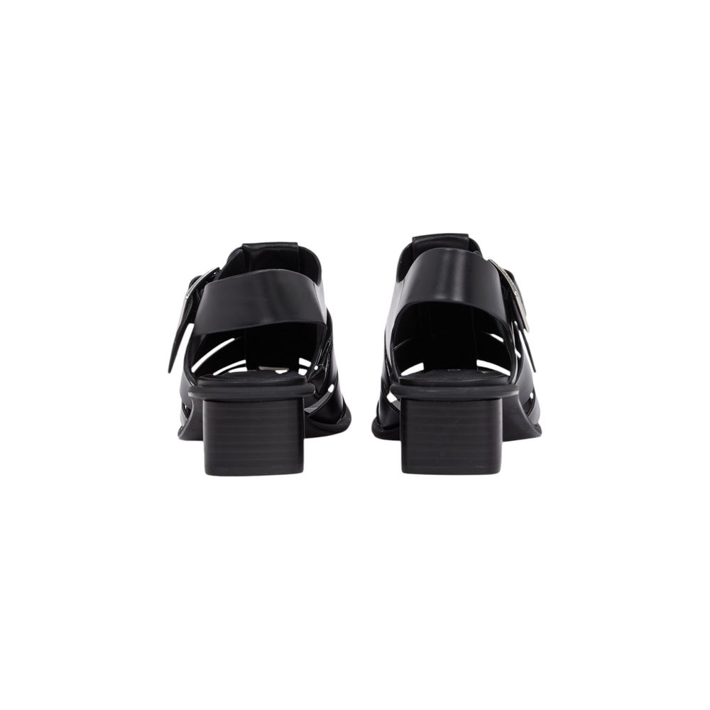 Flat Sandals by Calvin Klein Jeans for women in polyester & polyurethane and black presents a sculptural silhouette, showcasing the signature style of the Women's Polyester & Polyurethane Flat Sandals with a sculptural flat and sculptural .