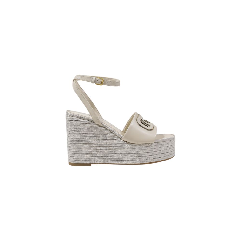 High-Heel Wedge Ankle Strap Pumps Heels by Guess for women in polyurethane cream showcases a effortless chic silhouette, perfectly accentuating Women's Polyurethane High-Heel Wedge Ankle Strap Pumps Heels with a effortless chic high-heel wedge and effortless chic .
