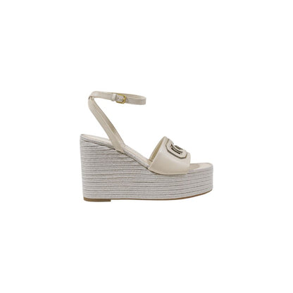 High-Heel Wedge Ankle Strap Pumps Heels by Guess for women in polyurethane cream showcases a effortless chic silhouette, perfectly accentuating Women's Polyurethane High-Heel Wedge Ankle Strap Pumps Heels with a effortless chic high-heel wedge and effortless chic .