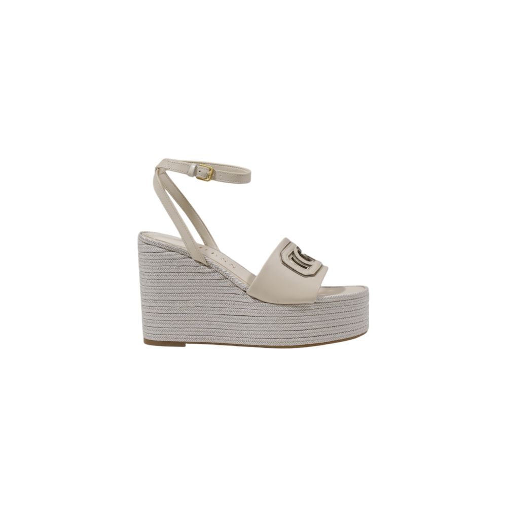 High-Heel Wedge Ankle Strap Pumps Heels by Guess for women in polyurethane cream features a effortless chic silhouette, showcasing the Women's Polyurethane High-Heel Wedge Ankle Strap Pumps Heels design with a effortless chic high-heel wedge and for a effortless chic finish.