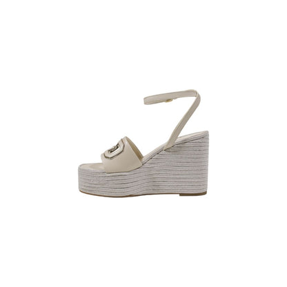 High-Heel Wedge Ankle Strap Pumps Heels by Guess for women in polyurethane cream features an effortlessly chic silhouette from the Women's Polyurethane High-Heel Wedge Ankle Strap Pumps Heels collection, showcasing a high-heel wedge and effortlessly chic for a effortlessly chic look.