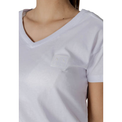 T-Shirt by Armani Exchange for women in cotton white showcases a unassuming silhouette, artfully detailed with a refined and unassuming for a sophisticated, contemporary look.