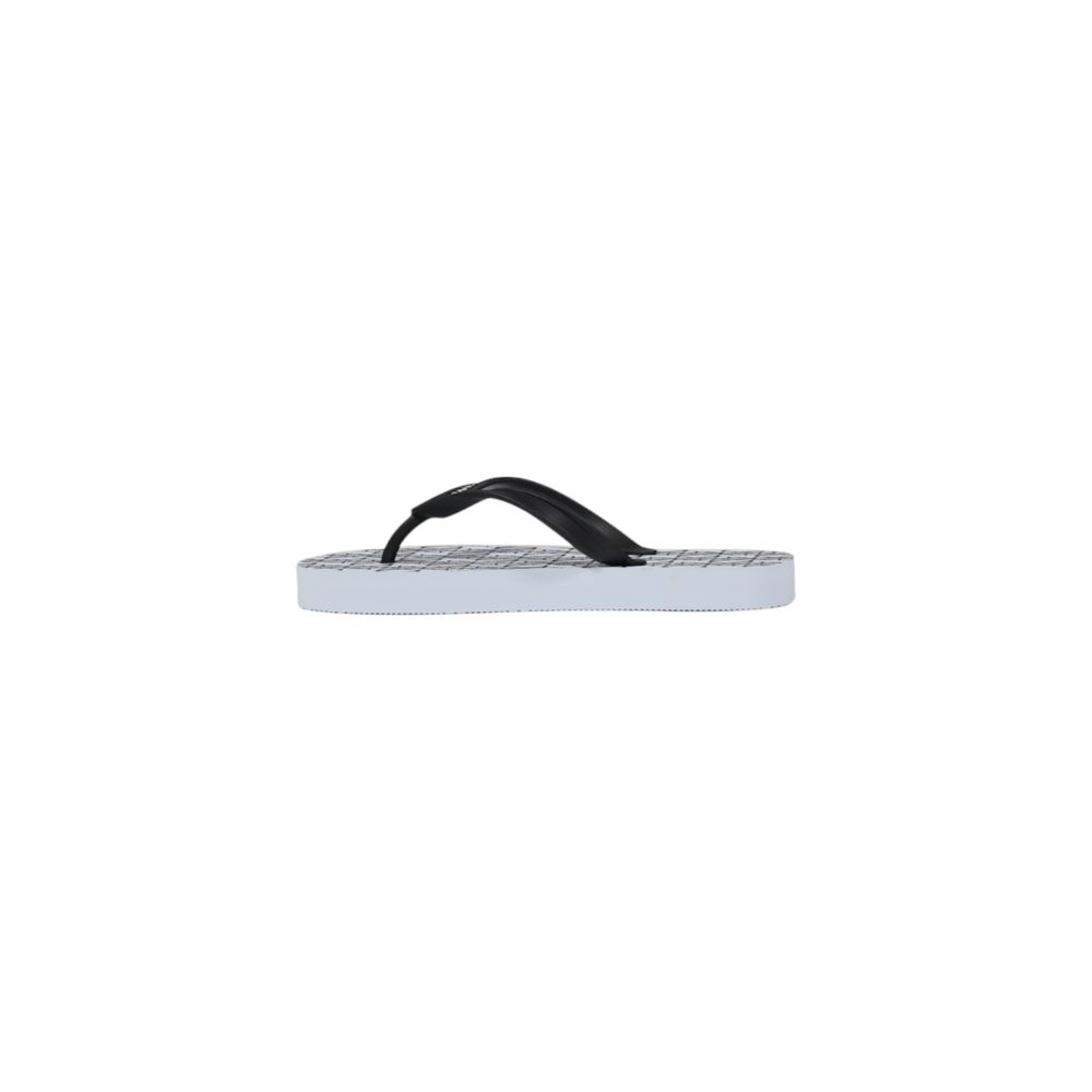 Flip-Flop Sandals by Armani Exchange for women in rubber white features an architectural design from the Women's Lightweight Rubber Flip-Flop Sandals collection, defined by a architectural and for a architectural finish.