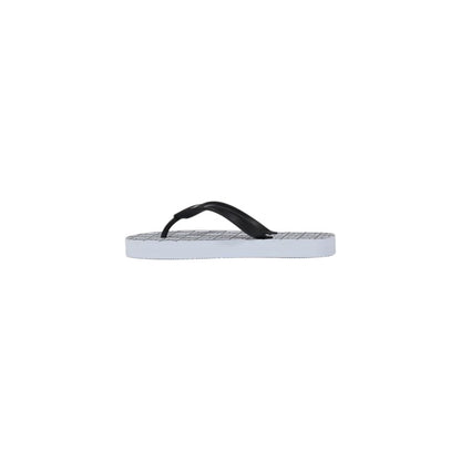 Flip-Flop Sandals by Armani Exchange for women in rubber white features an architectural design from the Women's Lightweight Rubber Flip-Flop Sandals collection, defined by a architectural and for a architectural finish.