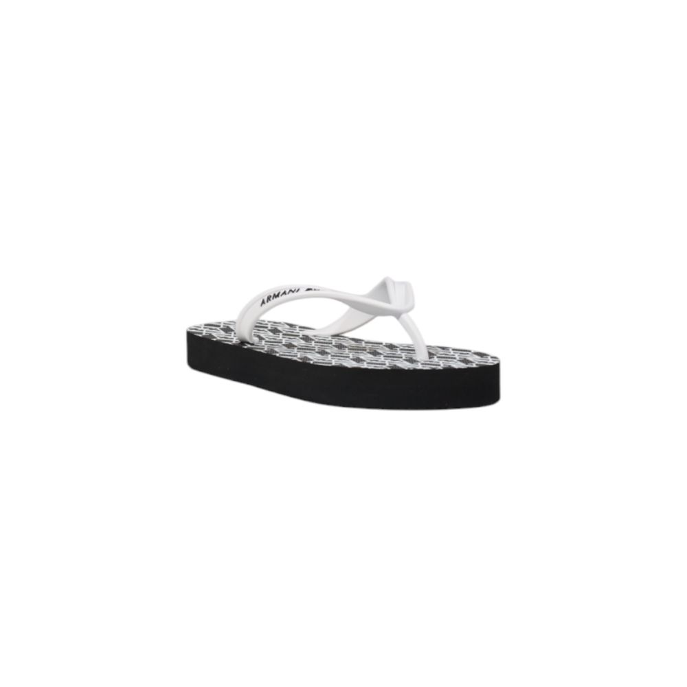 Flip-Flop Sandals by Armani Exchange for women in rubber and black & white presents a sculptural silhouette, showcasing the signature style of the Women's Lightweight Rubber Flip-Flop Sandals with a sculptural and sculptural .