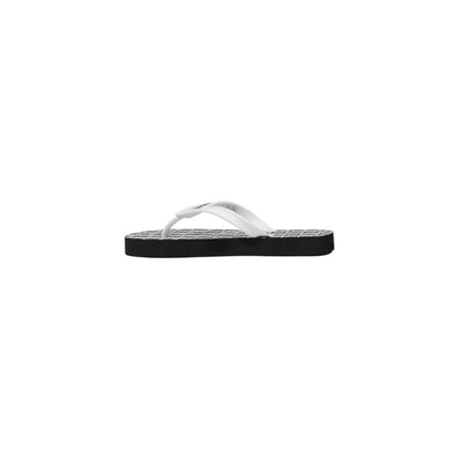 Flip-Flop Sandals by Armani Exchange for women in rubber black & white features an statuesque Women's Lightweight Rubber Flip-Flop Sandals silhouette with a refined and elegant .