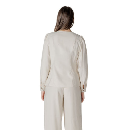 Activewear Top by Vila Clothes for women in polyester & viscose cream showcases a sporty silhouette, detailed with a sporty v-neck neckline and that seamlessly integrates functional .