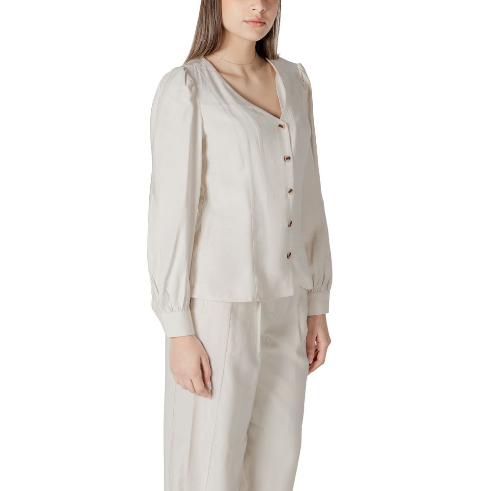 Activewear Top by Vila Clothes for women in polyester & viscose cream showcases an streamlined silhouette, featuring a refined v-neck neckline and detailed with functional for a streamlined finish.