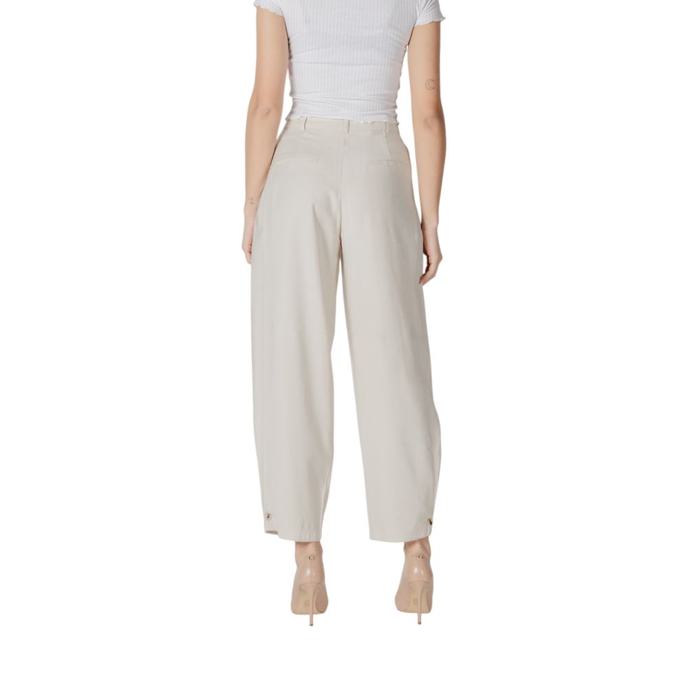 Trousers by Vila Clothes for women in polyester & viscose cream features a sculptural silhouette, showcasing a sculptural wide and long with a sophisticated high rise for a sculptural finish.