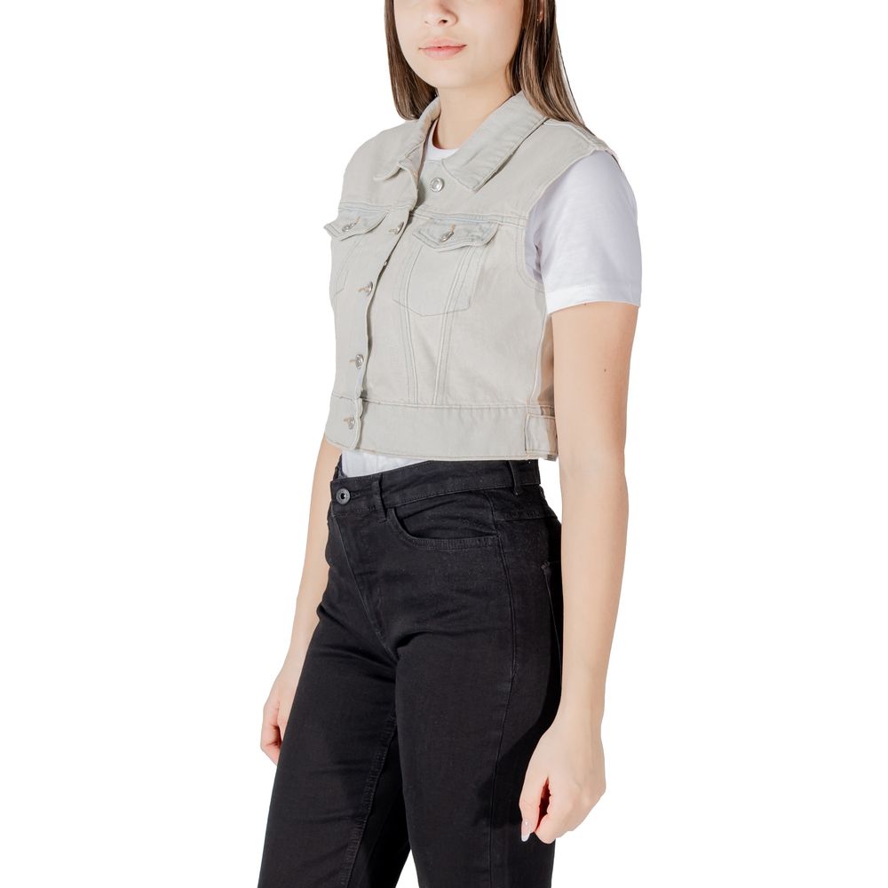 Vest by Only for women in cotton light-blue showcases a dynamic silhouette, perfectly balancing pockets with a dynamic for a sophisticated, high-fashion look.