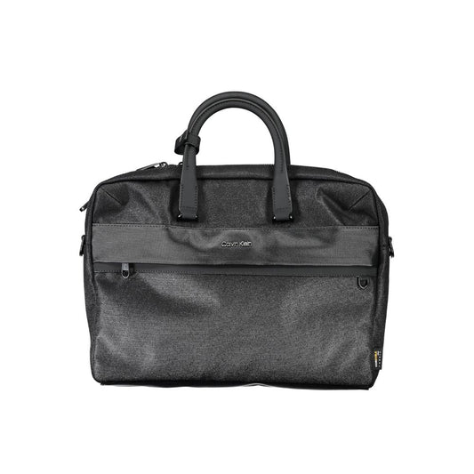 This Briefcase Handbag by Calvin Klein for unisex in polyester and black presents a sculptural silhouette featuring a secure zipper, ample built-in-compartments, document-holder, external-pockets, internal-pockets & laptop-compartment, and versatile shoulder-strap, adjustable-strap & handle for a sculptural finish.