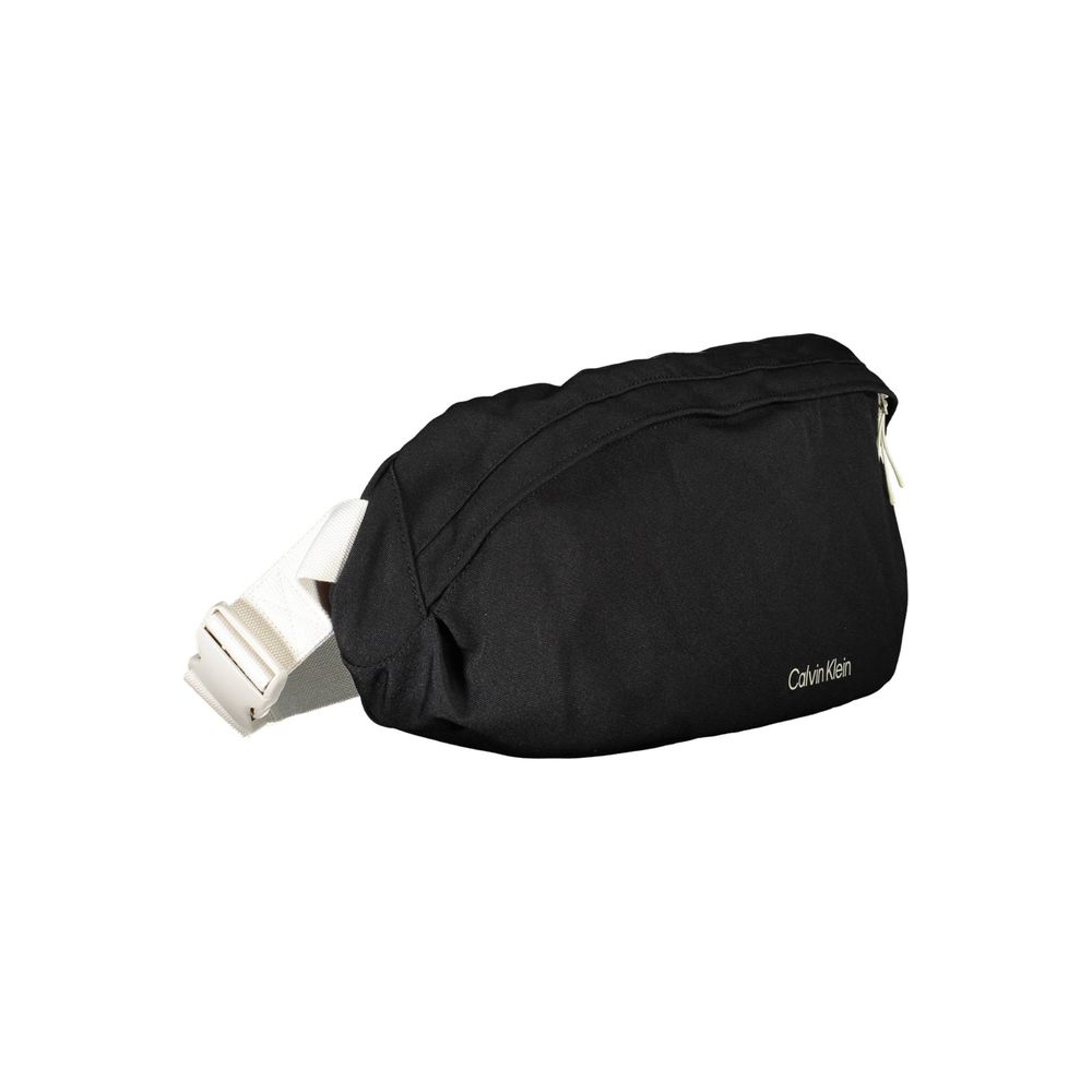 Belt Pouch Handbag by Calvin Klein for unisex in polyester black features a signature silhouette, showcasing a secure snap, zipper & buckle and signature laptop-compartment with versatile belt-strap for a sophisticated look.