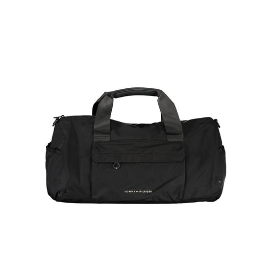 Handbag by Tommy Hilfiger for unisex in polyester black & print features a ornamental silhouette, showcasing a secure zipper, ample built-in-compartments, external-pockets & internal-pockets, and ornamental shoulder-strap, adjustable-strap & handle for a sophisticated look.