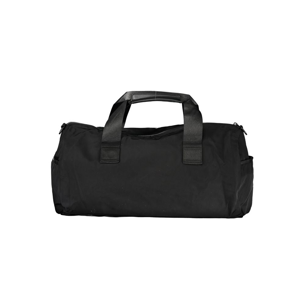 Handbag by Tommy Hilfiger for unisex in polyester black & print features a signature silhouette, showcasing a secure zipper and signature built-in-compartments, external-pockets & internal-pockets with versatile shoulder-strap, adjustable-strap & handle for a sophisticated look.