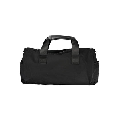 Handbag by Tommy Hilfiger for unisex in polyester black & print features a signature silhouette, showcasing a secure zipper and signature built-in-compartments, external-pockets & internal-pockets with versatile shoulder-strap, adjustable-strap & handle for a sophisticated look.