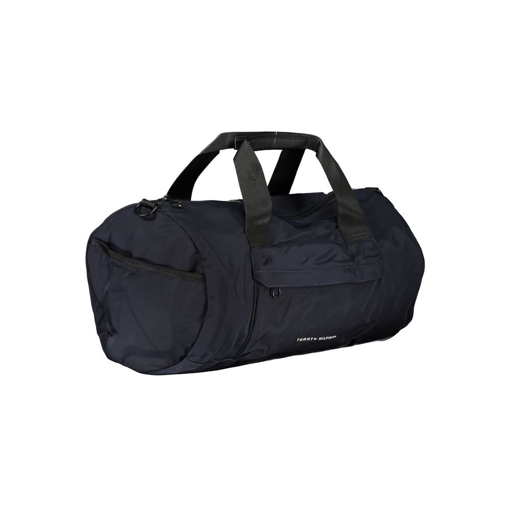 Handbag by Tommy Hilfiger for unisex in polyester blue, signature & print features a refined silhouette, showcasing a secure zipper, organized external-pockets & internal-pockets, and versatile shoulder-strap, adjustable-strap & handle for a refined finish.