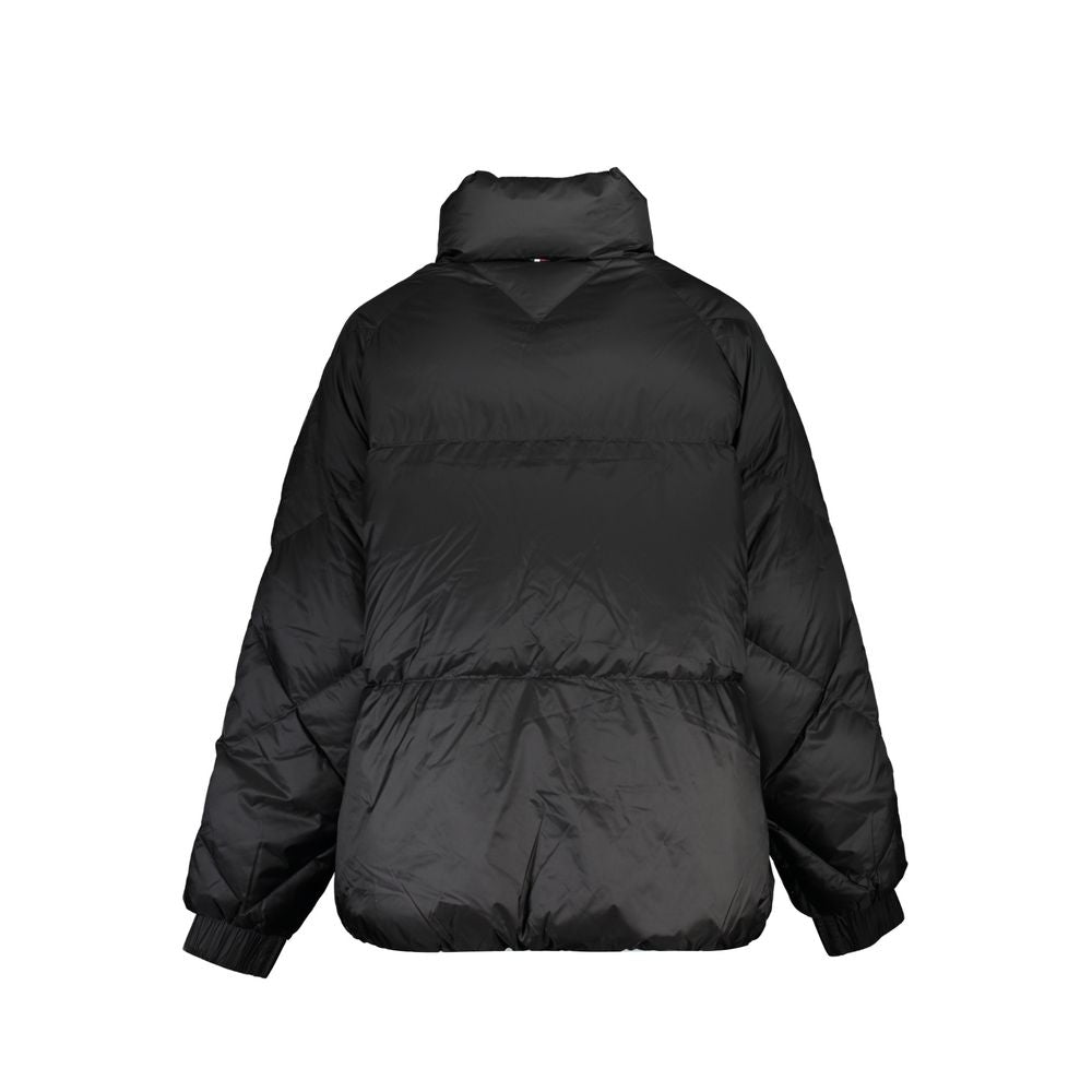 Puffer Jacket by Tommy Hilfiger for women in polyester black features a dramatic silhouette, showcasing a sophisticated and distinctive pockets & insulated for a dramatic aesthetic.