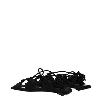 Flat Sandals by The Attico for women in suede leather black showcases a sculptural silhouette as Women's Suede Leather Flat Sandals, defined by a sculptural flat and sculptural for a sculptural look.