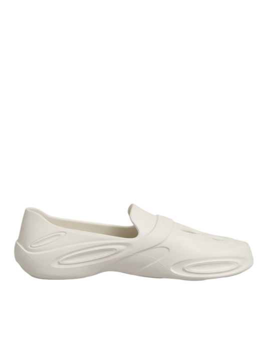 Clogs Sliders Flat Shoes by Dolce & Gabbana for men in thermoplastic polyurethane white features an captivating silhouette, showcasing the captivating style of the Men's Thermoplastic Polyurethane Clogs Sliders Flat Shoes with its distinct and refined .