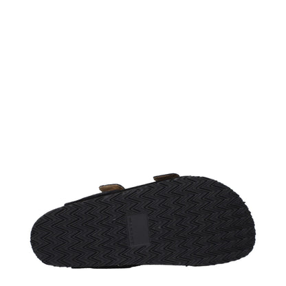 Flat Clogs Slippers by Isabel Marant for men in suede leather & rubber black & silver features an timeless Men's Suede Leather & Rubber Flat Clogs Slippers aesthetic, defined by a flat and a refined open toe style.