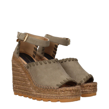 Sandals by Stella McCartney for women in suede leather and green presents a captivating silhouette, showcasing the signature style of the Women's Suede Leather Sandals with a captivating and captivating .