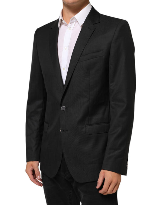 Blazer by Dolce & Gabbana for men in virgin wool & rayon black showcases a discerning silhouette, elegantly detailed with a sophisticated single-breasted neckline and premium for a truly discerning finish.