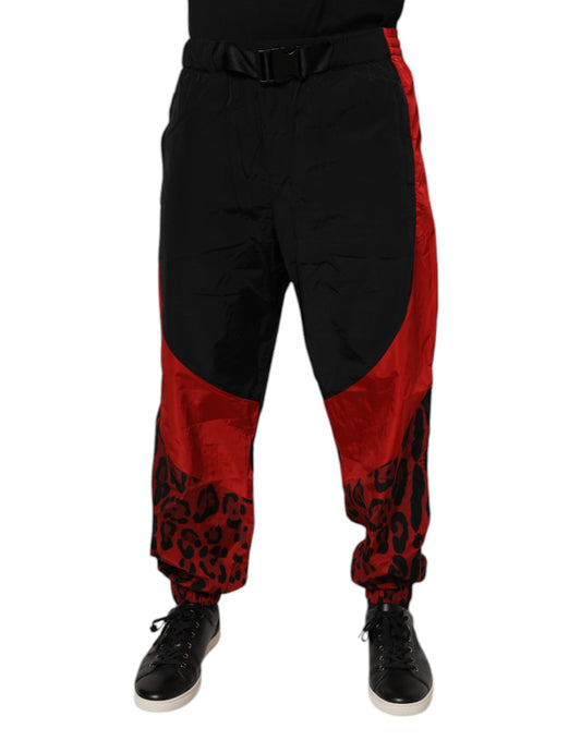 Joggers by Dolce & Gabbana for men in nylon black, red, leopard-print & print features an refined tailoring silhouette, showcasing a premium relaxed-fit & regular-fit with a and long cut for a refined tailoring look.