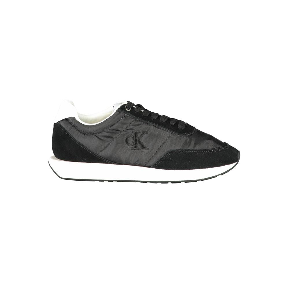 Sneakers by Calvin Klein for women in polyester & suede leather black presents a sumptuous silhouette from the Women's Low-Top Polyester & Suede Leather Sneakers collection, showcasing a sumptuous low-top style for an elevated aesthetic.