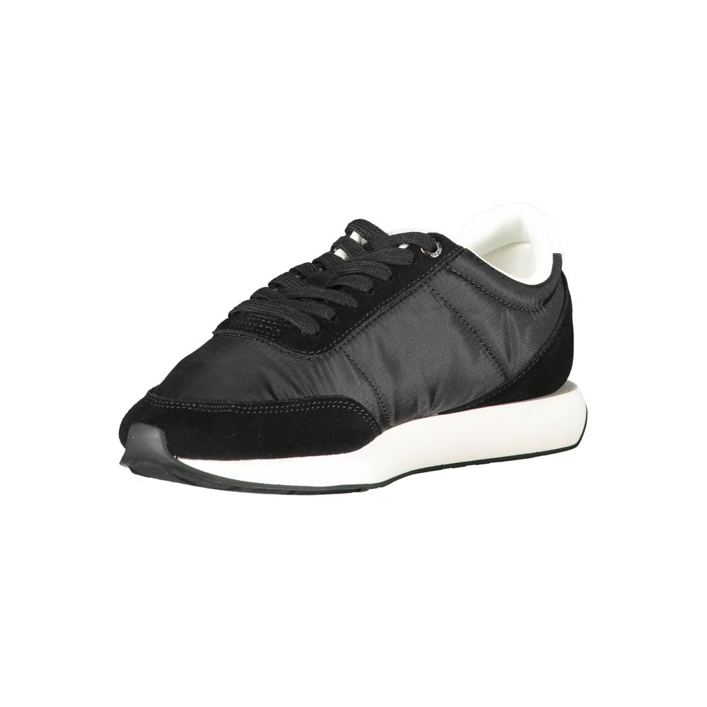 Sneakers by Calvin Klein for women in polyester & suede leather black presents a sumptuous silhouette from the Women's Low-Top Polyester & Suede Leather Sneakers collection, showcasing a sumptuous low-top style for an elevated aesthetic.