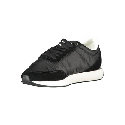 Sneakers by Calvin Klein for women in polyester & suede leather black presents a sumptuous silhouette from the Women's Low-Top Polyester & Suede Leather Sneakers collection, showcasing a sumptuous low-top style for an elevated aesthetic.