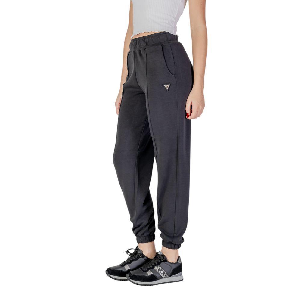 Activewear Jogger Pants by Guess Active for women in stretch polyester & modal black features a contemporary silhouette with , a contemporary , long hem, and high rise for a premium, high-performance aesthetic.