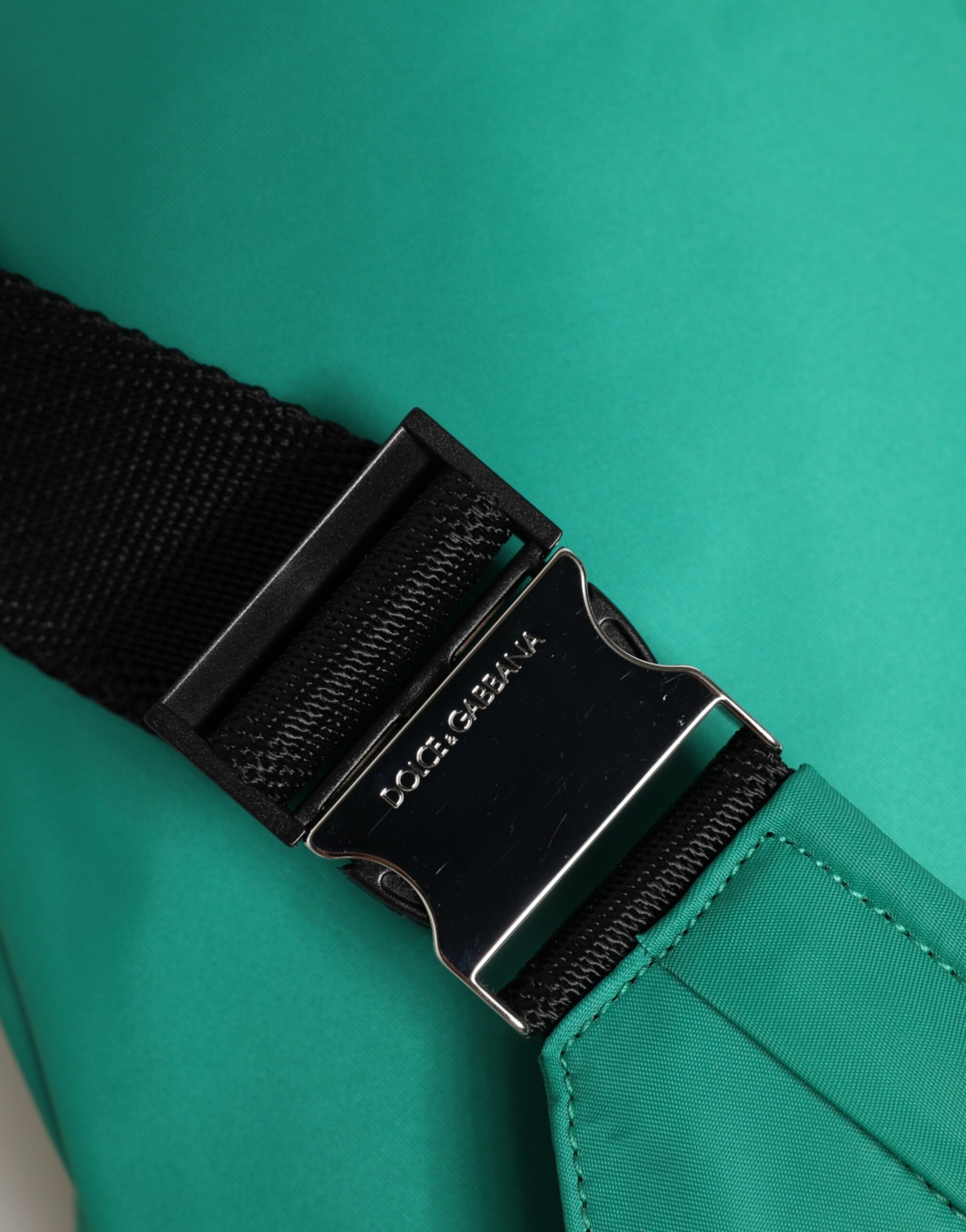 Fanny Pack Belt Bag by Dolce & Gabbana for men in calf leather & polyamide blue & green features an jet-set ready Calf Leather Polyamide Fanny Pack Belt Bag design with a secure zipper, jet-set ready built-in-compartments, and versatile adjustable-strap & belt-strap for a sophisticated look.