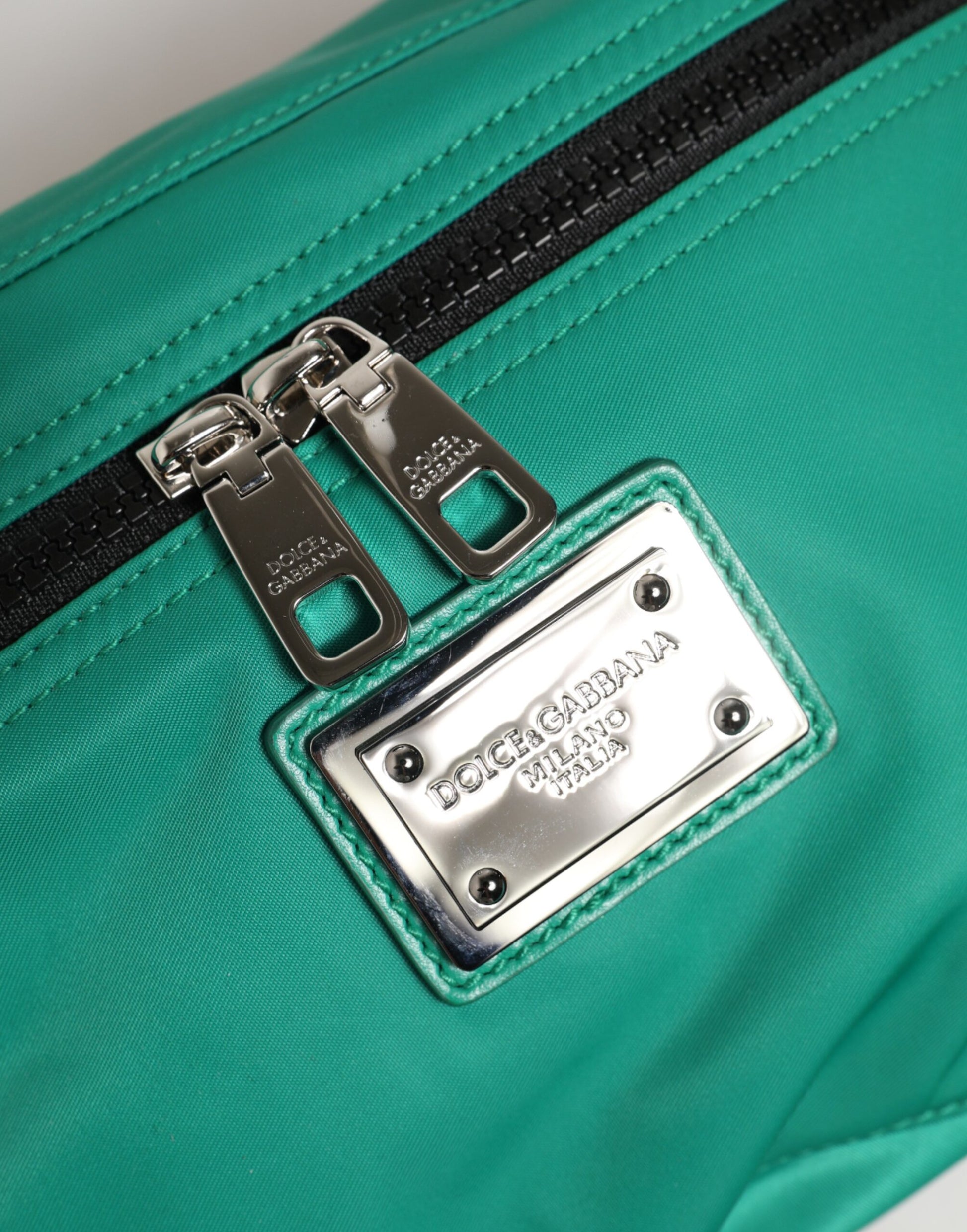 Fanny Pack Belt Bag by Dolce & Gabbana for men in calf leather & polyamide blue & green features a jet-setting Calf Leather Polyamide Fanny Pack Belt Bag design with a secure zipper, jet-setting built-in-compartments, and versatile adjustable-strap & belt-strap for a jet-setting look.