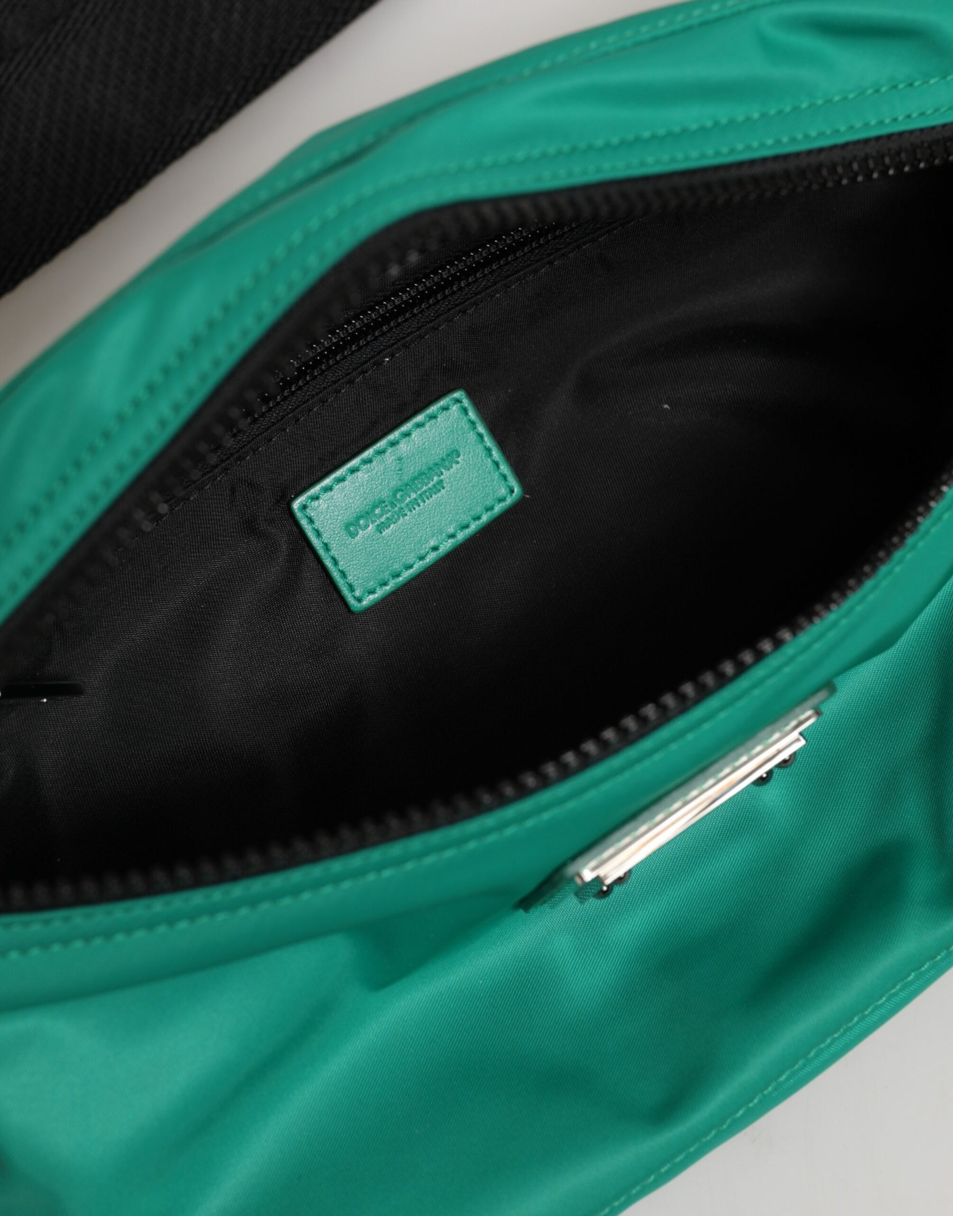Fanny Pack Belt Bag by Dolce & Gabbana for men in calf leather & polyamide blue & green features an globetrotter chic Calf Leather Polyamide Fanny Pack Belt Bag design with a secure zipper, ample built-in-compartments, and versatile adjustable-strap & belt-strap for a globetrotter chic look.