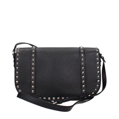 Crossbody Messenger Bag by Valentino Garavani for men in leather black showcases a artisanal Leather Crossbody Messenger Bag design, featuring a secure and ample with versatile crossbody-strap & adjustable-strap for a artisanal look.