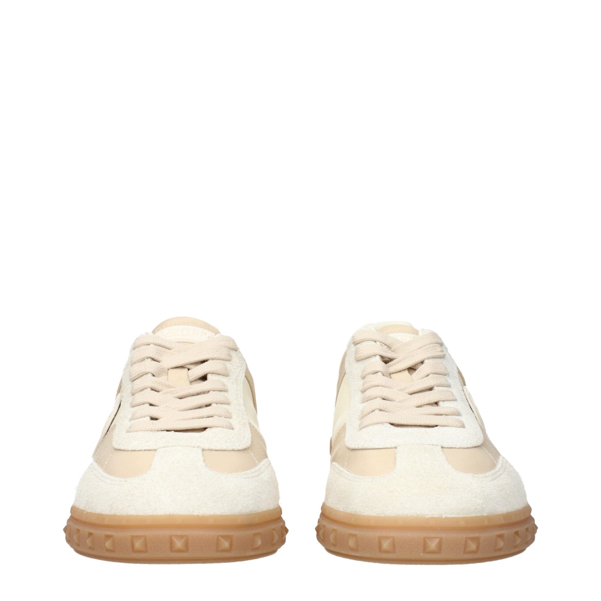 Sneakers by Valentino Garavani for men in fabric beige presents a sumptuous silhouette, artfully capturing the essence of the Men's Low Top Fabric Sneakers with its sumptuous low-top style design.