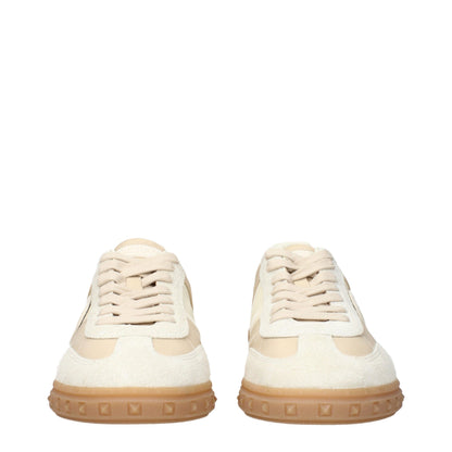Sneakers by Valentino Garavani for men in fabric beige presents a sumptuous silhouette, artfully capturing the essence of the Men's Low Top Fabric Sneakers with its sumptuous low-top style design.