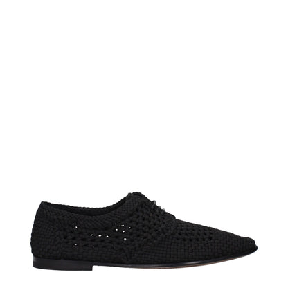Flat Lace-Up Shoes by Dolce & Gabbana for men in leather black features an effortless chic silhouette, showcasing the Men's Leather Flat Lace-Up Shoes design with an effortless chic flat and a round toe style for a effortless chic look.