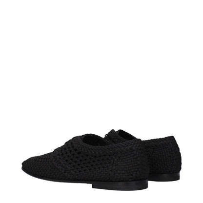Flat Lace-Up Shoes by Dolce & Gabbana for men in leather black features an effortless chic silhouette, showcasing the Men's Leather Flat Lace-Up Shoes design with an effortless chic flat and a round toe style for a effortless chic look.