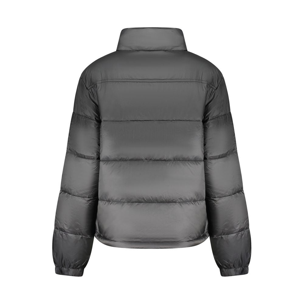 Windbreaker Jacket by Tommy Hilfiger for women in polyester black features an perennial silhouette with a refined and perennial pockets & windproof for a sophisticated weather-resistant look.