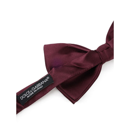 Necktie by Dolce & Gabbana for men in silk bordeaux & burgundy features a sun-drenched silhouette, showcasing the sun-drenched design of this Silk Necktie with a sun-drenched finish.