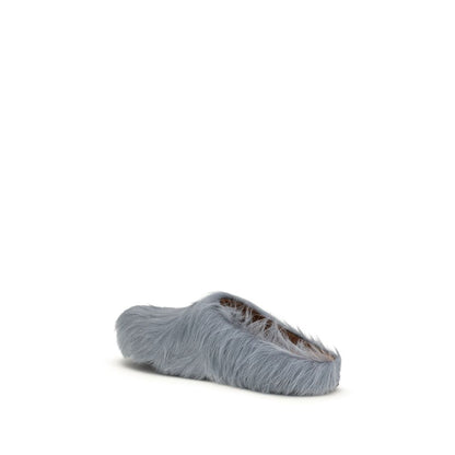 Flat Mule Mules Slip-On Shoes by Marni for men in bost taurus calf leather & fur light-blue showcases a impeccable silhouette as Men's Bost Taurus Calf Leather & Fur Flat Mule Mules Slip-On Shoes, artfully designed with a impeccable flat and refined for a impeccable finish.