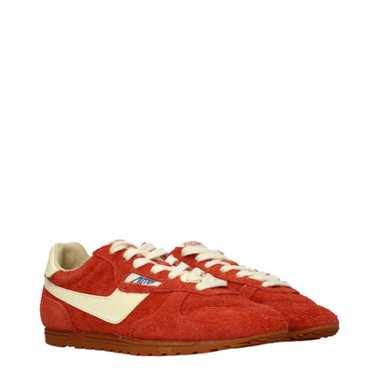 Sneakers by Autry for women in suede leather orange presents a on trend silhouette from the Women's Fashion Suede Leather Sneakers collection, showcasing a on trend fashion style for an elevated aesthetic.