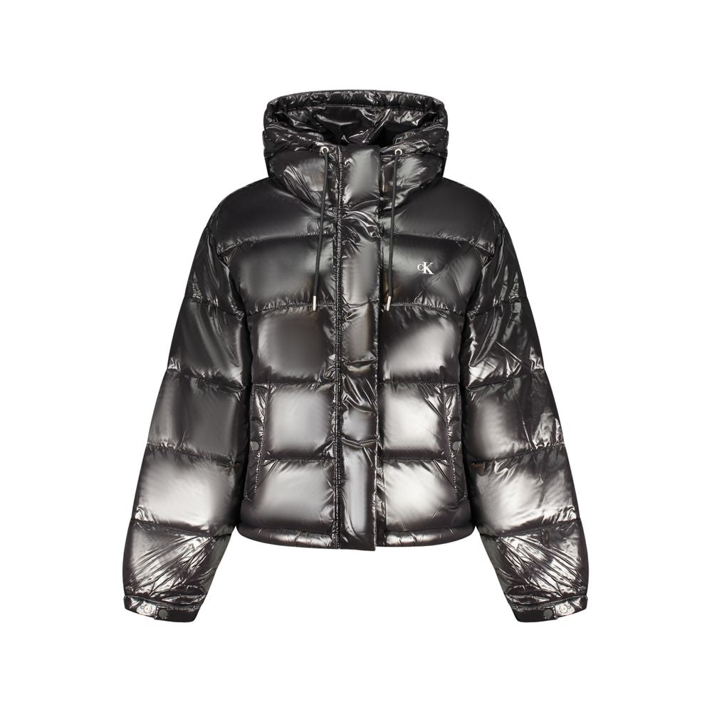 Hooded Windbreaker Jacket by Calvin Klein for women in polyester black & print presents a resilient silhouette, artfully detailed with a sophisticated hooded neckline and functional pockets, hooded & windproof for a resilient finish.
