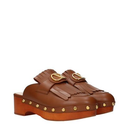 Clogs Slippers by Valentino Garavani for women in leather brown features an timeless Women's Leather Clogs Slippers aesthetic, defined by a and a refined .