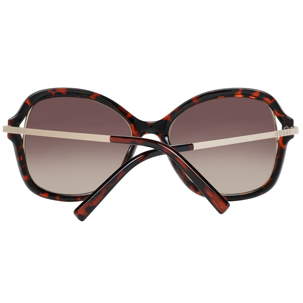 This Sunglasses by Guess for women in brown presents a sumptuous silhouette, showcasing a sumptuous butterfly full-rim frame design in brown coloured frame and high-performance gradient category-2-medium-tint lens.