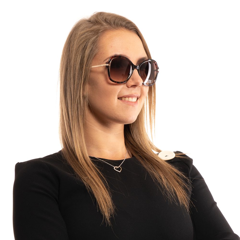 Sunglasses by Guess for women in brown features a sumptuous silhouette, showcasing a sumptuous butterfly full-rim frame design in brown coloured frame with high-performance gradient category-2-medium-tint lens.